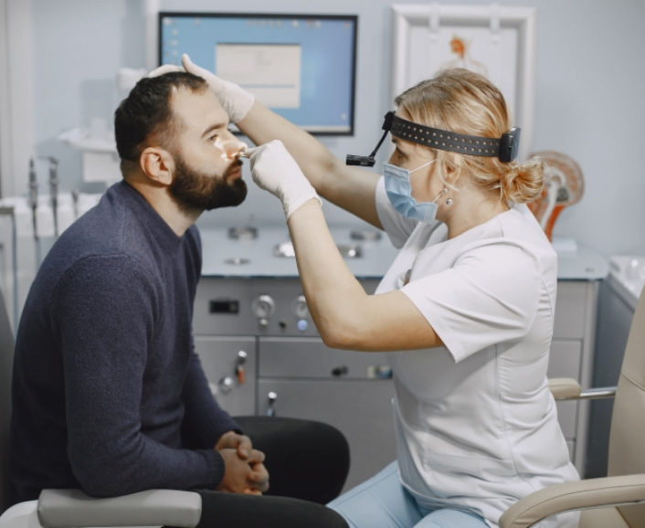 man having eye check