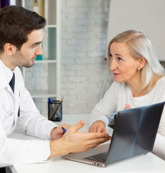 doctor and patient looking at computer screen