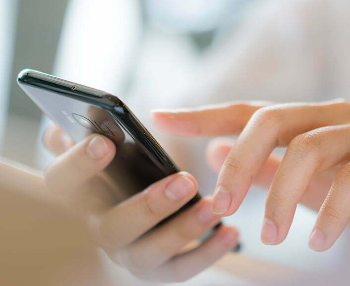 Business hand with mobile phone .